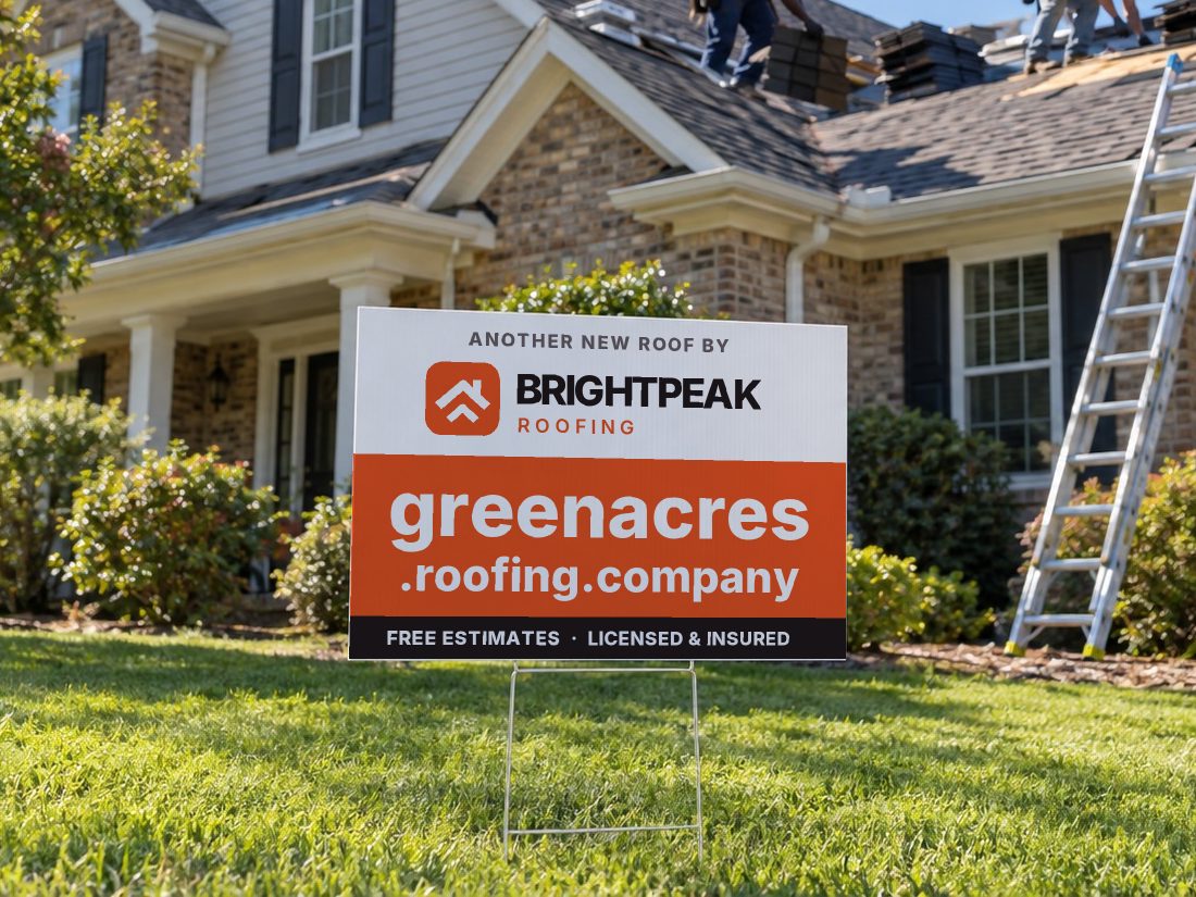 greenacres.roofing.company on a yard sign in front of a house getting a new roof